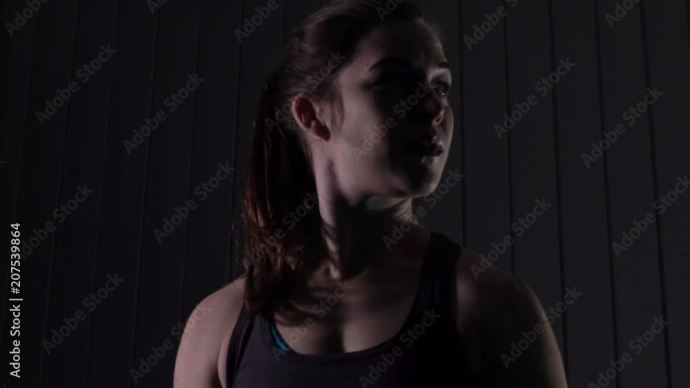 Beautiful Young Woman Athlete In Gymnastic Suit Doing Exercises For Shoulders Muscles in Gym Beautiful Young Woman Athlete In Gymnastic Suit Doing Exercises For Shoulders Muscles in Gym
