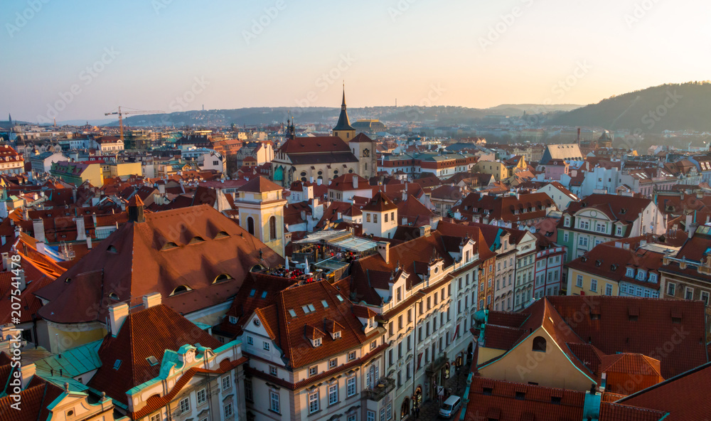 Sunset in Prague, Czech Republic. Aerial view at the scenic cityscape with red roofs of old town