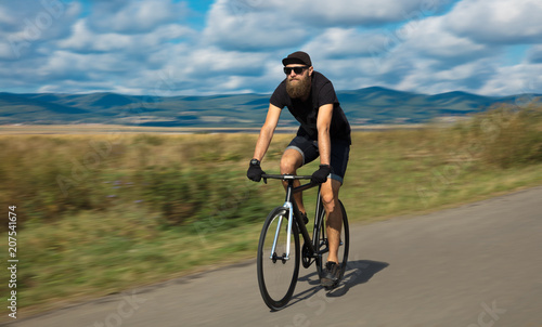 Natural view with cyclist going somewhere with stylish bike