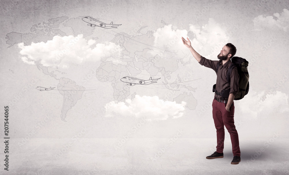 Handsome young man standing with a backpack on his back and planes in front of a world map as a background Handsome young man standing with a backpack on his back and planes in front of a world map as a background