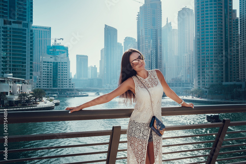 Photography Happy beautiful unrecognizable tourist woman in fashionable summer white dress