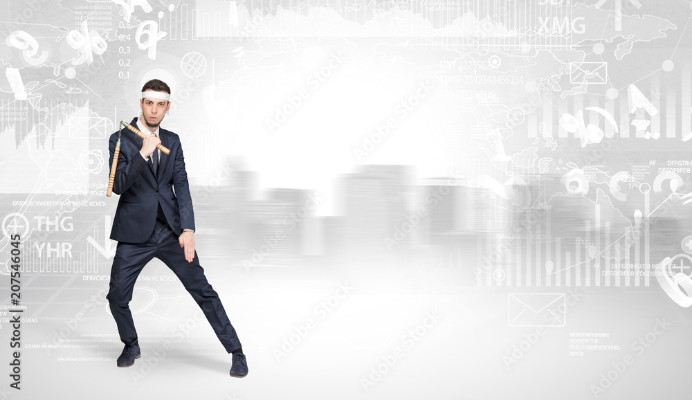 Young suited karate trainer doing karate tricks on the top of a metropolitan city Young suited karate trainer doing karate tricks on the top of a metropolitan city