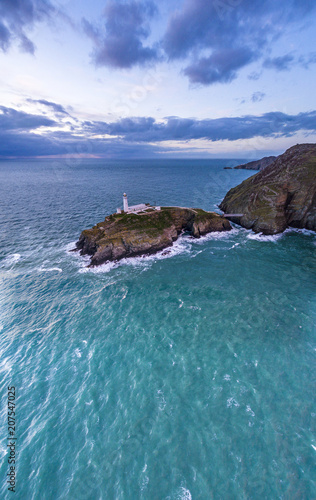 Aerial view of South Stack with lighthouse during sunset photo