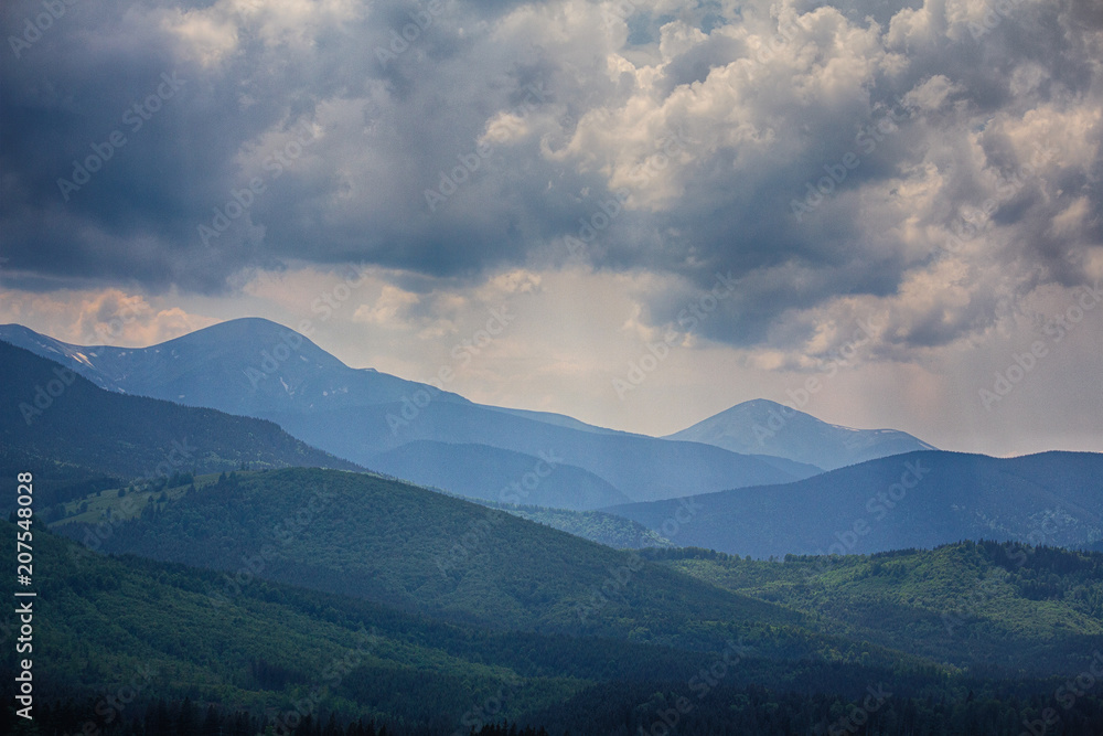 Dramatic sky above the Montenegrin ridge, the mountains of Goverla and Petros. Carpathians