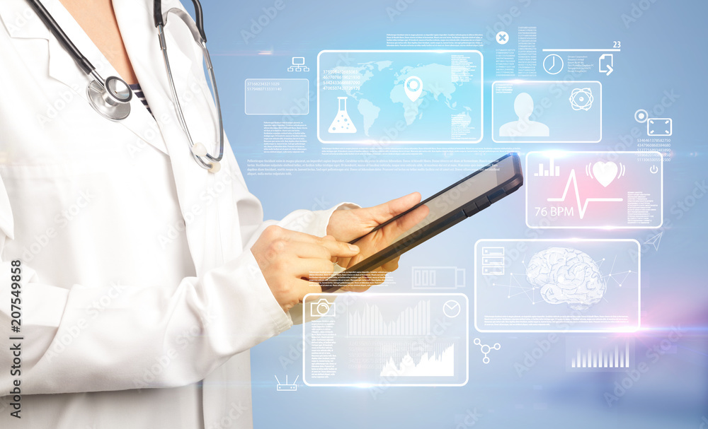Female doctor holding tablet with blue background and informative graphs and charts Female doctor holding tablet with blue background and informative graphs and charts