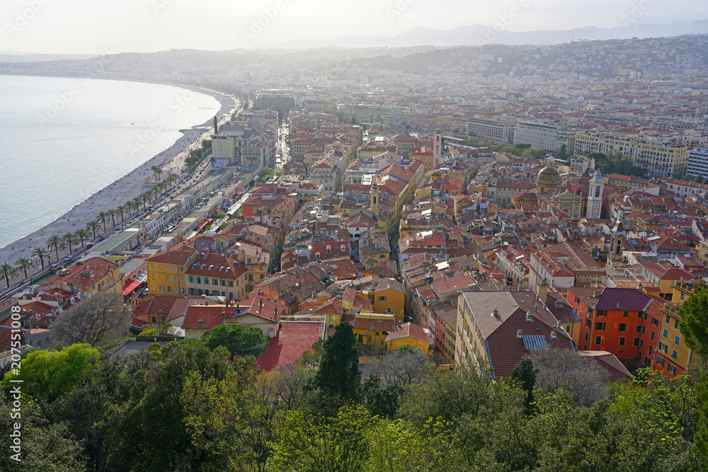 Landscape view at sunset of the Promenade des Anglais along the Mediterranean Sea in Nice, French Riviera, France seen from the Colline du Chateau.