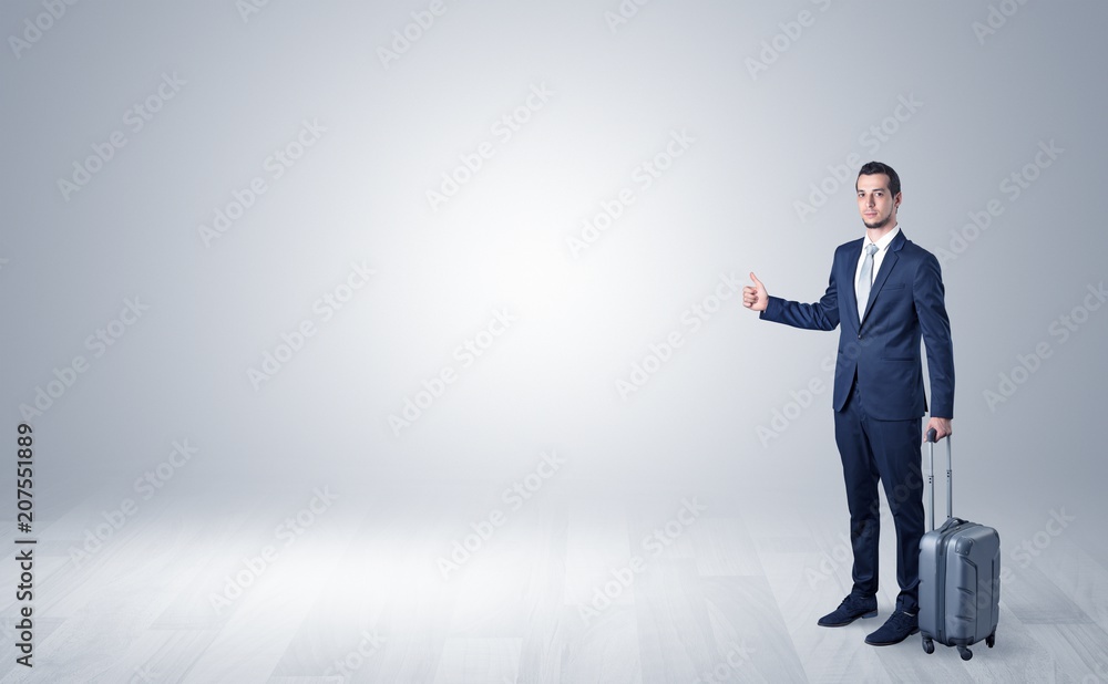 Lonely businessman hitchhikes concept with copy space around him
