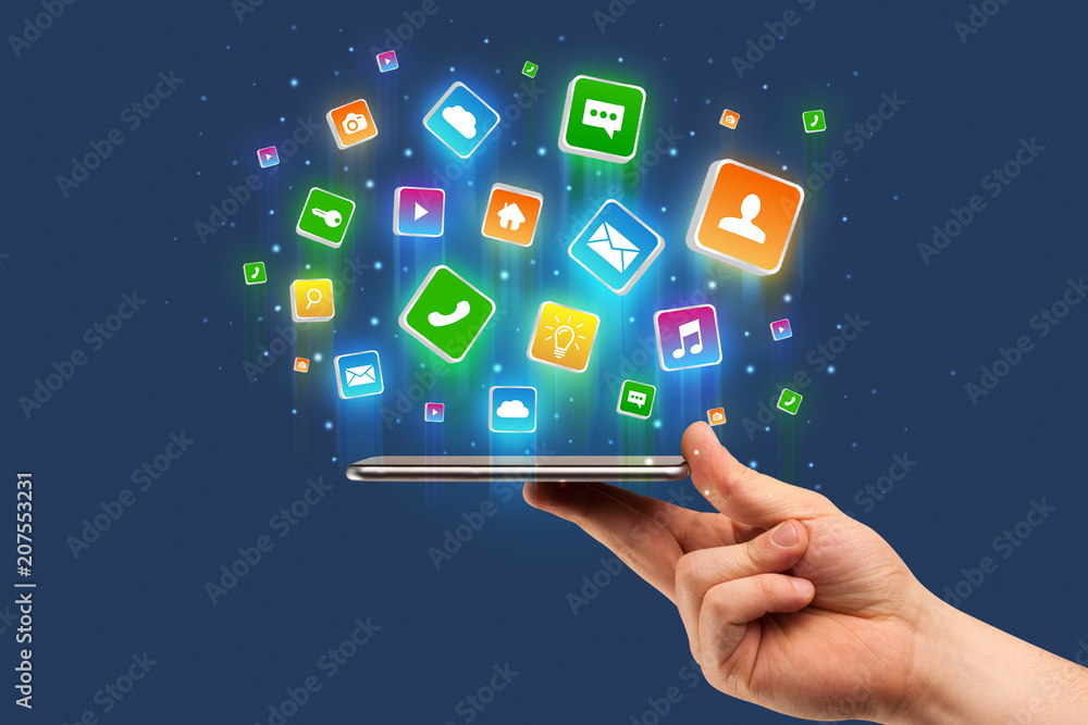 Businessman hand using phone with flying application icons around
Businessman hand using phone with flying application icons around