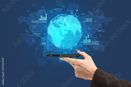 Hand using phone with multinational worldwide estate report concept 