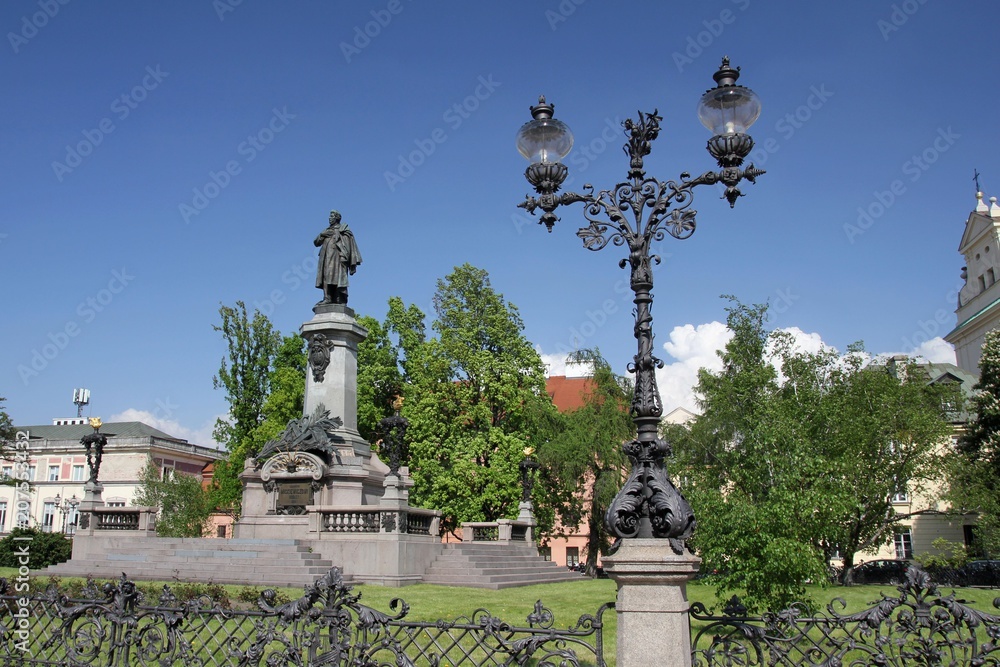 Fototapeta premium Monument of polish poet Adam Mickiewicz at Krakowskie Przedmiescie street in Warsaw, Poland.