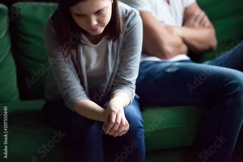 Sad frustrated wife feeling disappointed upset after fight with husband, depressed millennial girlfriend offended, jealous and angry at boyfriend tired of bad relationships and marriage problems