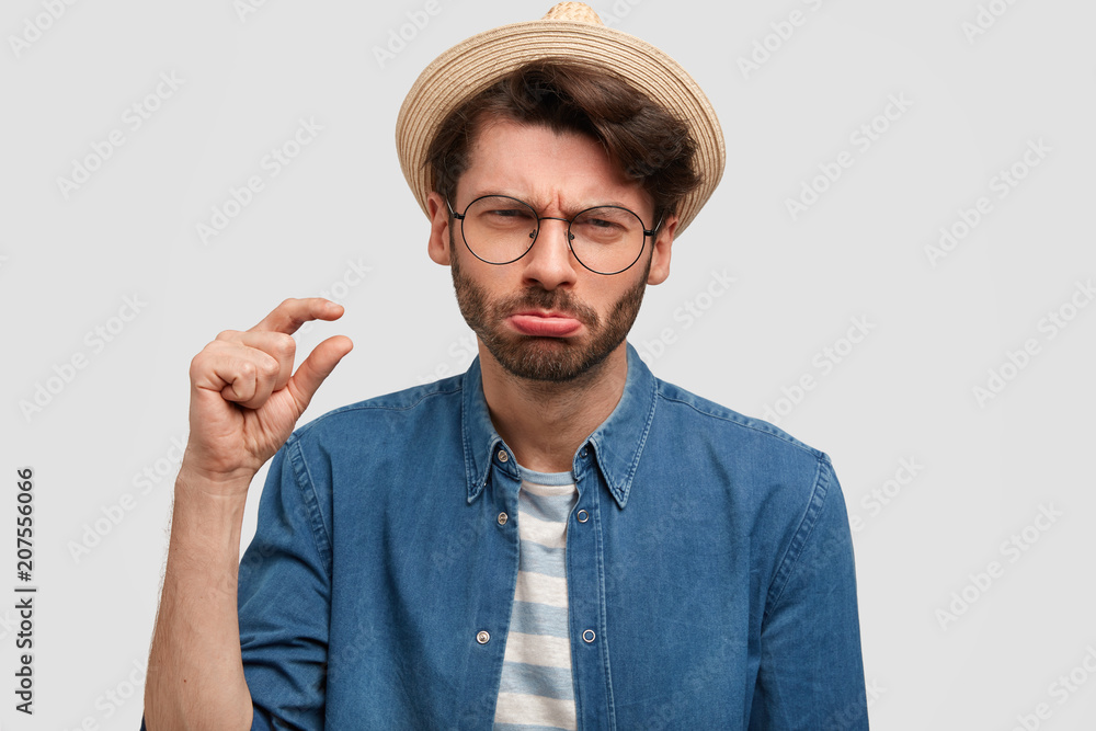 Portrait of scrupulous bearded young 