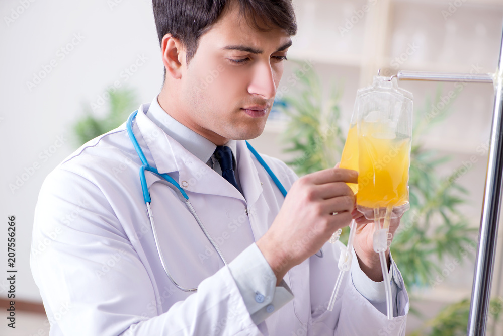 Doctor with bag of blood plasma in hospital Doctor with bag of blood plasma in hospital