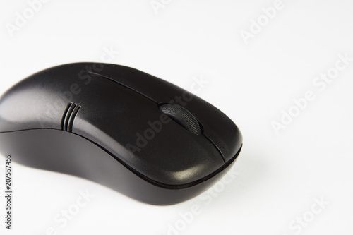 Wireless computer mouse isolated on white background, close-up. Black optical computer mouse.