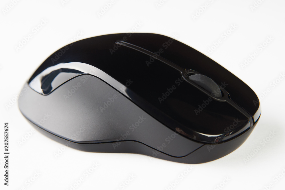 Wireless computer mouse isolated on white background, close-up. Black optical computer mouse. Wireless computer mouse isolated on white background, close-up. Black optical computer mouse.