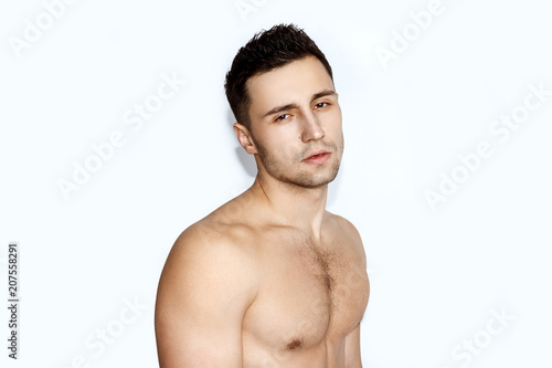 Sport guy with white towel on white background