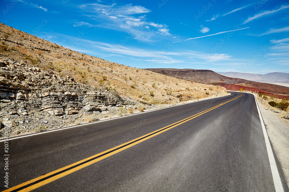 Naklejka premium Picture of a desert road, travel concept.