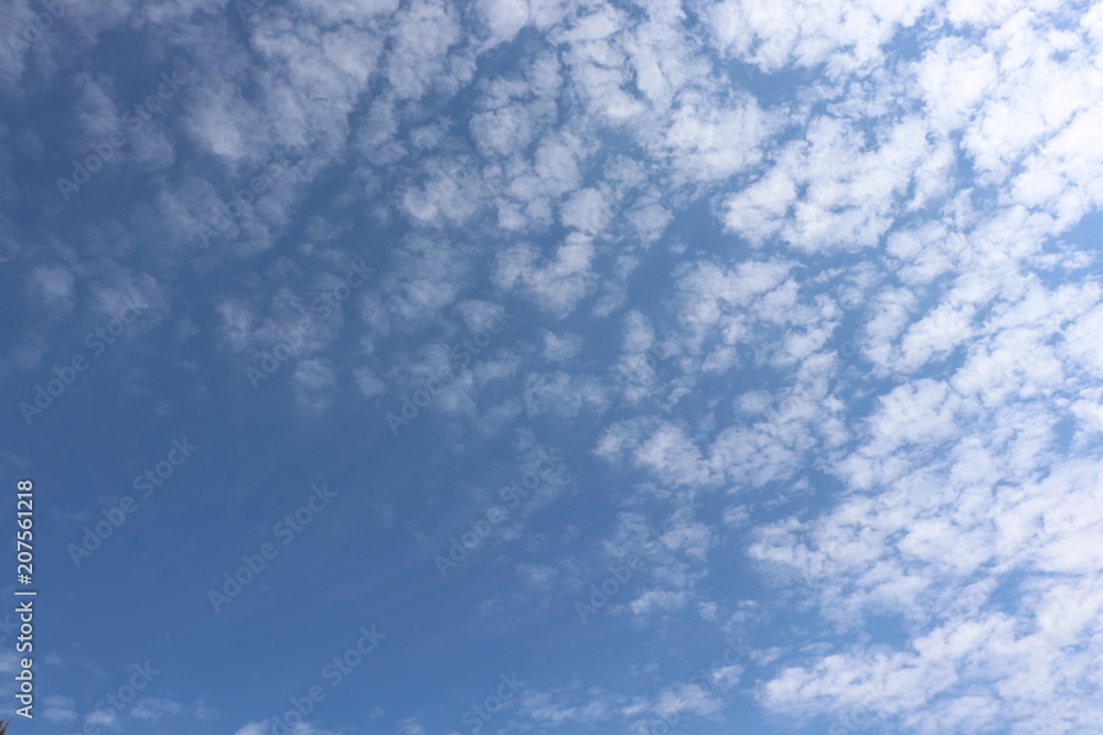 Close up of fluffy white clouds against blue sky Close up of fluffy white clouds against blue sky