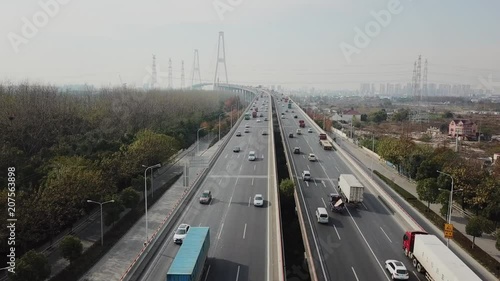 aerial shooting of traffic on big industrial chinnese city slow-motion photo