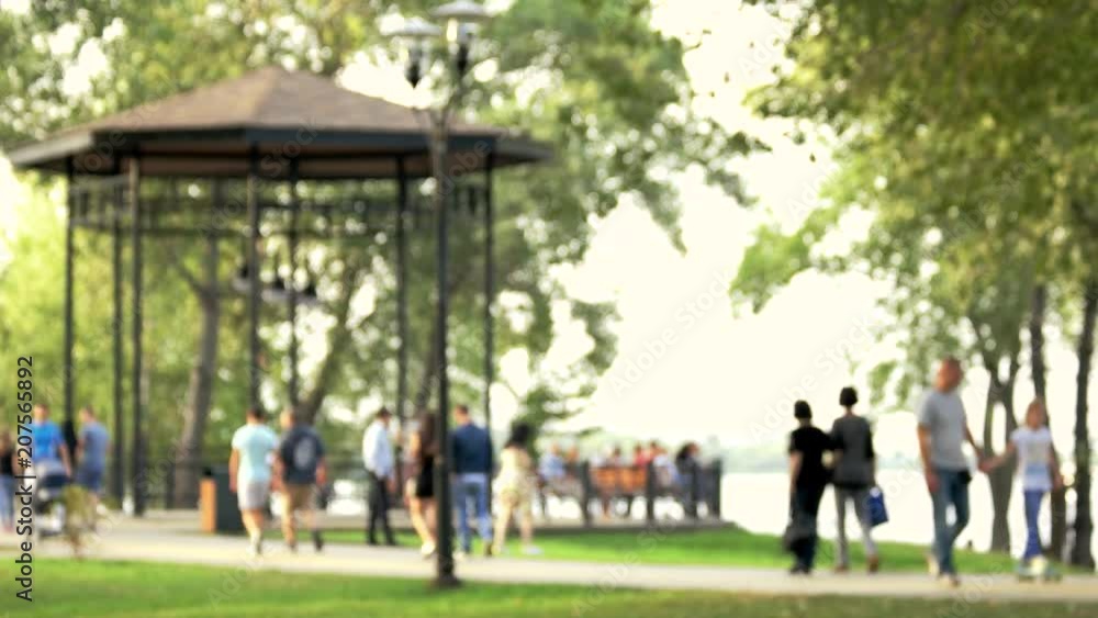 Blurred background of people in park. Spring and summer season. Blurred background of people in park. Spring and summer season.