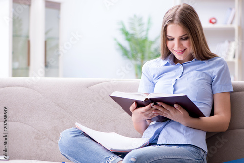 Young female student preparing for college exams