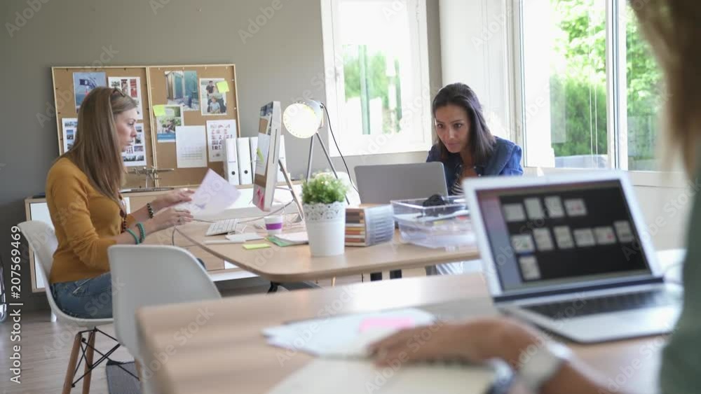 Businesswomen working in co-working space Businesswomen working in co-working space