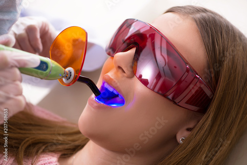 Patient visiting dentist for regular check-up and filling photo