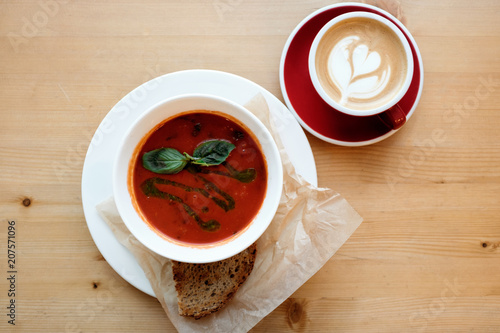 Tomato soup with basil and bread. 