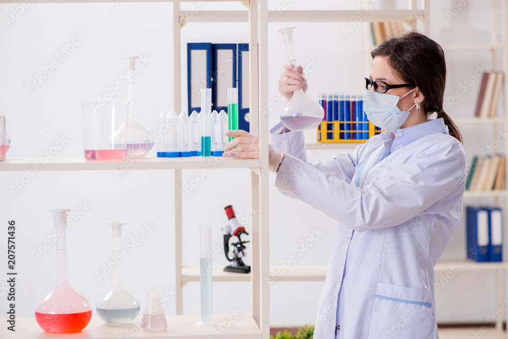 Female chemist working in hospital lab Female chemist working in hospital lab