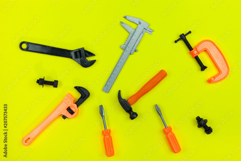 Flat lay of set mechanic tools on paper background,Concept Father's Day gift and industrial background. Flat lay of set mechanic tools on paper background,Concept Father's Day gift and industrial background.