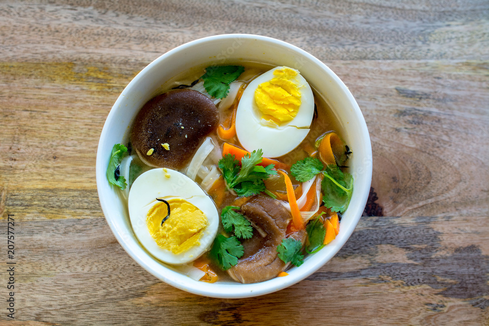 Rice Noodle soup with vegetables and salmon, closeup and top view Rice Noodle soup with vegetables and salmon, closeup and top view