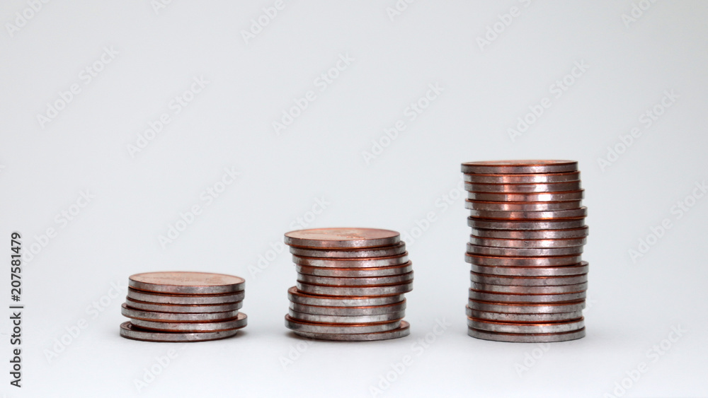 Three piles of different heights coins. Three piles of different heights coins.