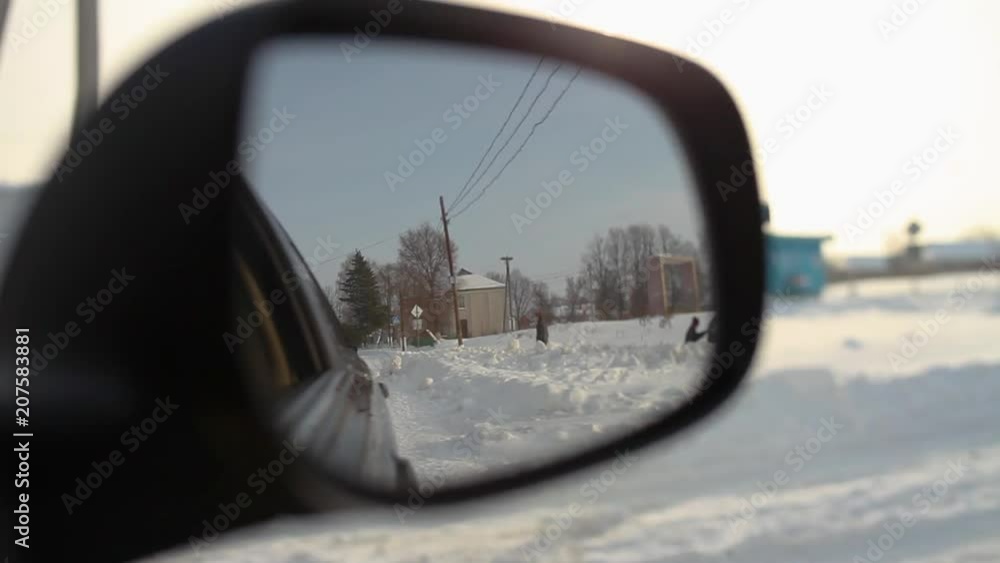 driving in Medzhybizh, Ukraine. POV of car mirror driving in Medzhybizh, Ukraine. POV of car mirror