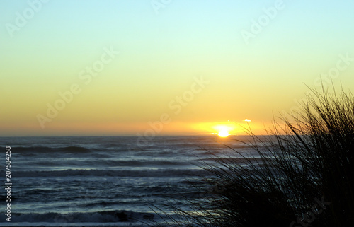 Sunset looking from Hokitika, West coast, New Zealand east toward the Tasman sea.