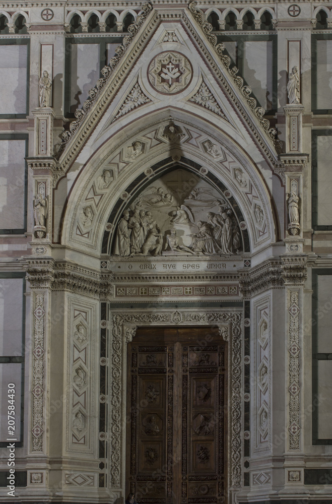 Architectural detail of Holy Cross church main door, Florence