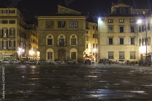 Night view of Santa Croce square in Florence, after rain