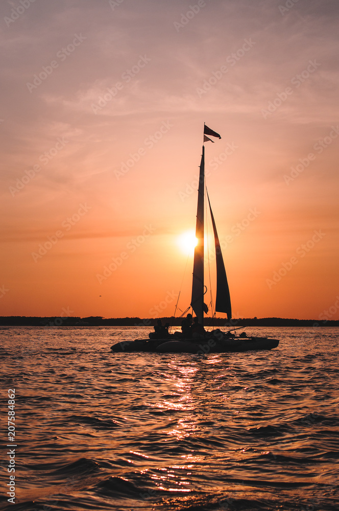 lonely sail at sunset