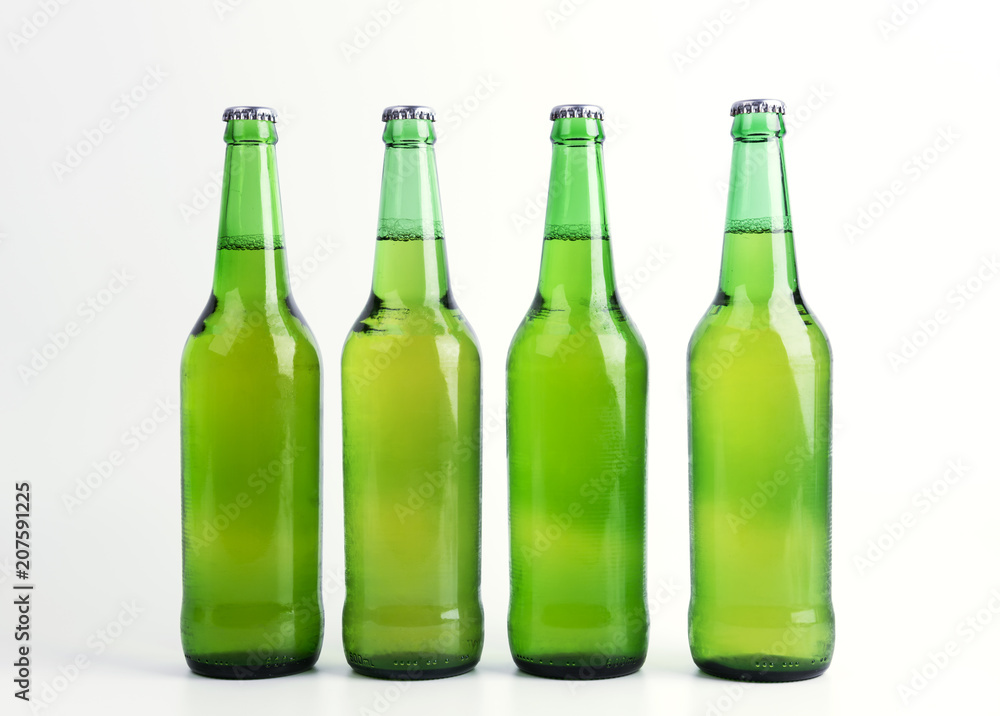 Four bottles of beer isolated on white background Four bottles of beer isolated on white background