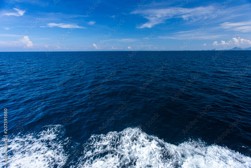 Blue Seawater with sea foam as background Blue Seawater with sea foam as background