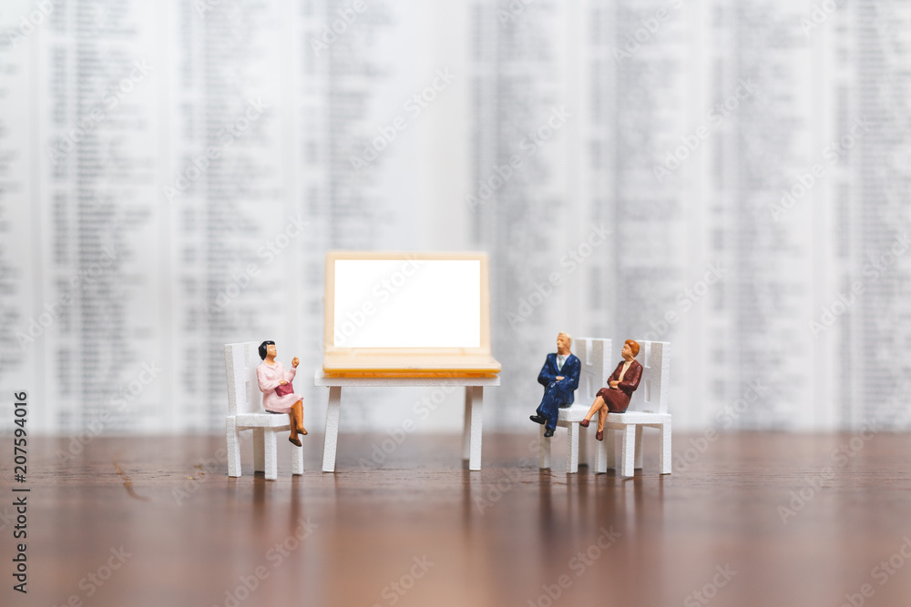 Fototapeta premium Miniature people: Businessman thinking with project for presenting investment on White screen computer laptop , Business and technology concept 