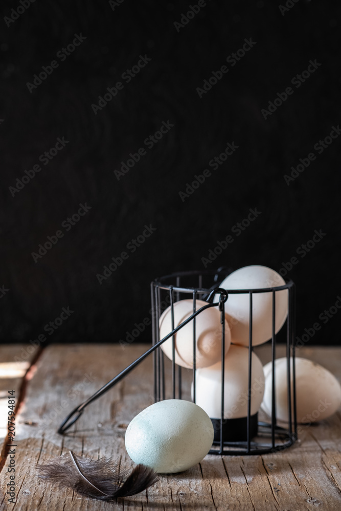 raw eggs on a black background raw eggs on a black background