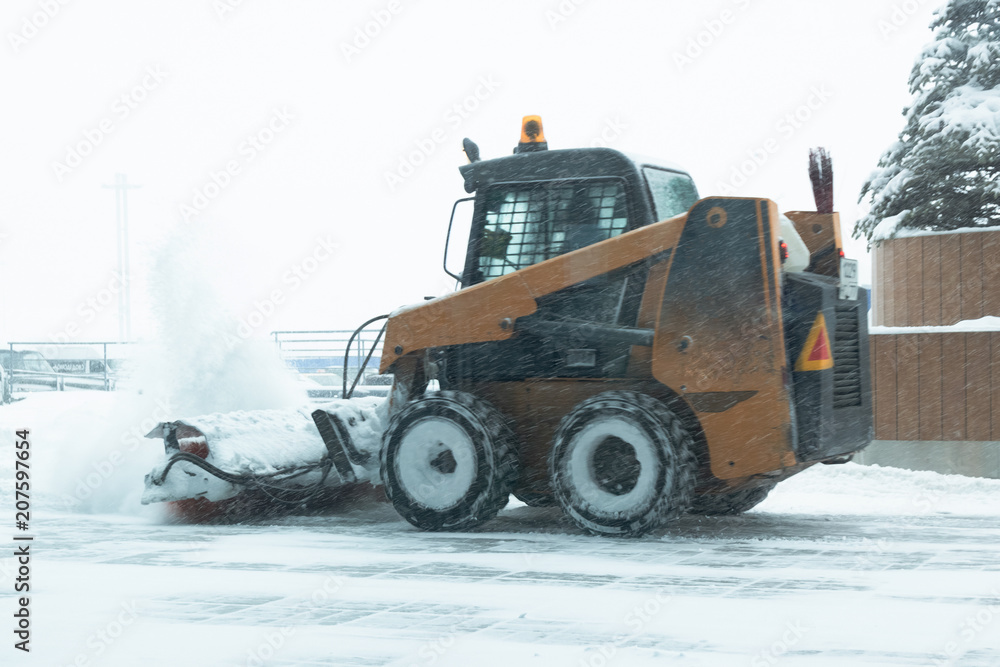 machine for snow removal cleans the road machine for snow removal cleans the road