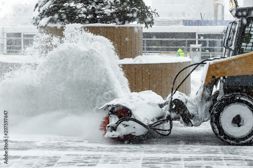 machine for snow removal cleans the road