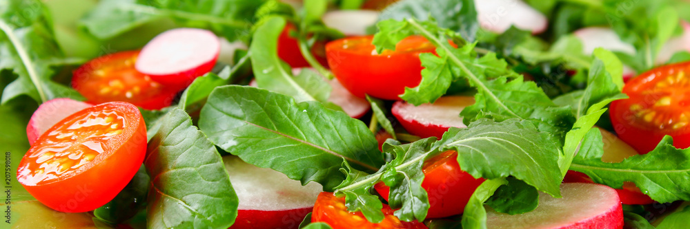 Vegetarian salad of arugula, tomato, radish and mozzarella cheese on an old wooden table. Vegetarian salad of arugula, tomato, radish and mozzarella cheese on an old wooden table.