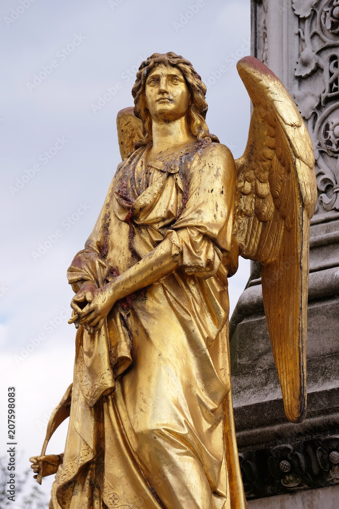 Golden statue of angel on the fountain in front of cathedral Assumption of the Virgin Mary in Zagreb, Croatia Golden statue of angel on the fountain in front of cathedral Assumption of the Virgin Mary in Zagreb, Croatia