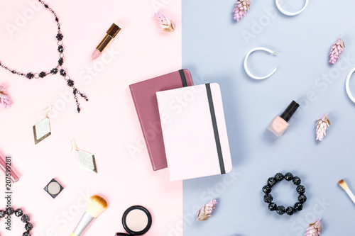 Note book, woman beauty accessories flat lay on pastel background. Fashion or beauty blogger concept.