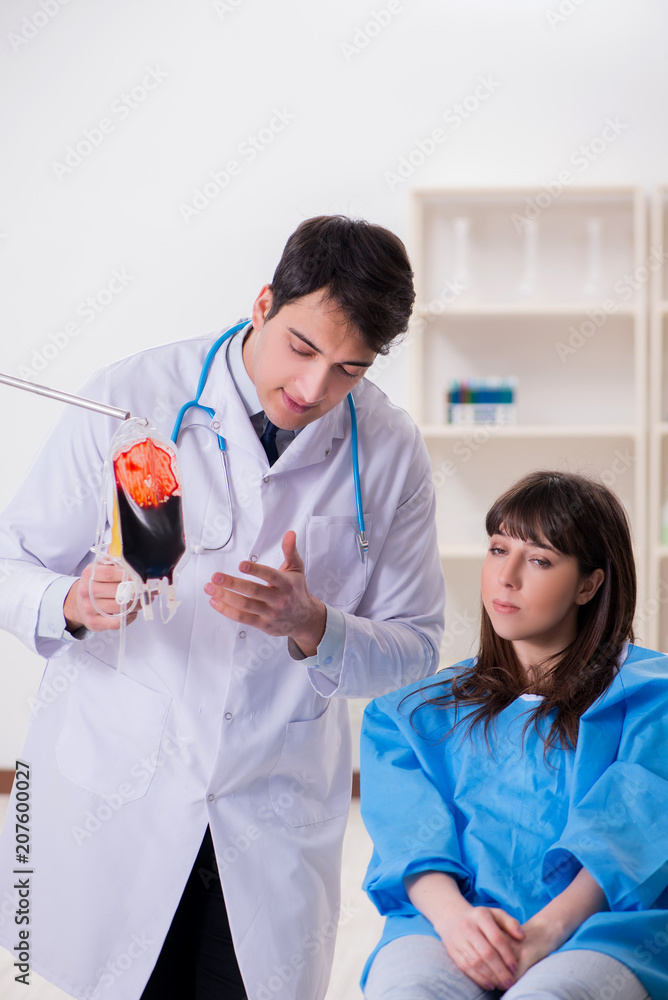 Doctor discussing blood transfusion with patient Doctor discussing blood transfusion with patient