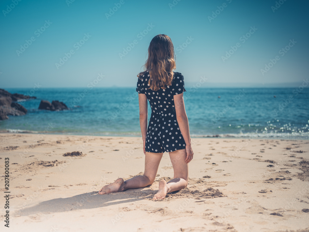 Beautiful young woman relaxing on the beach