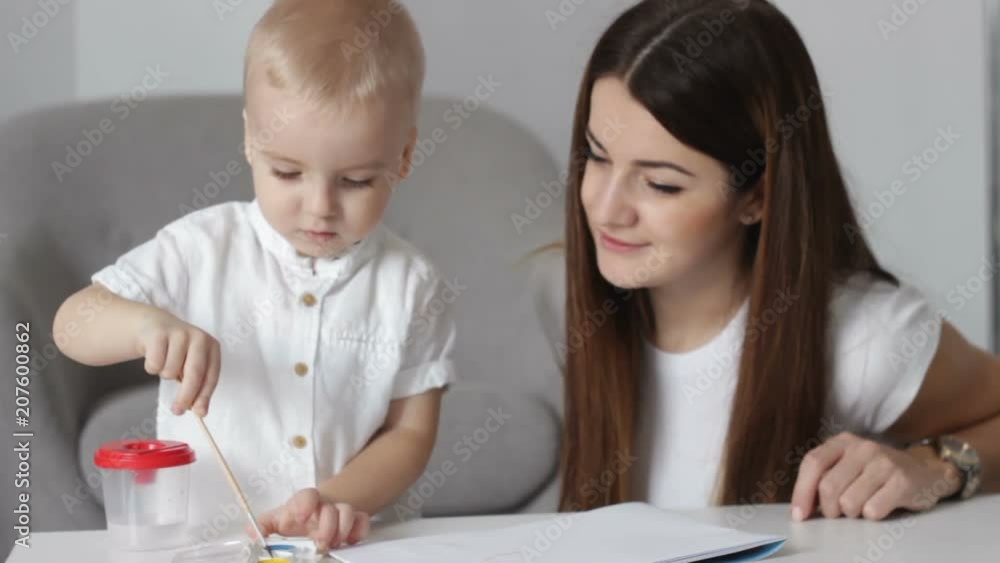 little boy tries to draw himself, development of independence at an early age little boy tries to draw himself, development of independence at an early age