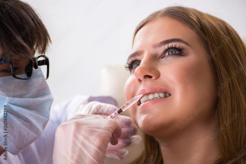 Woman patient visiting dentist for regular check-up Woman patient visiting dentist for regular check-up